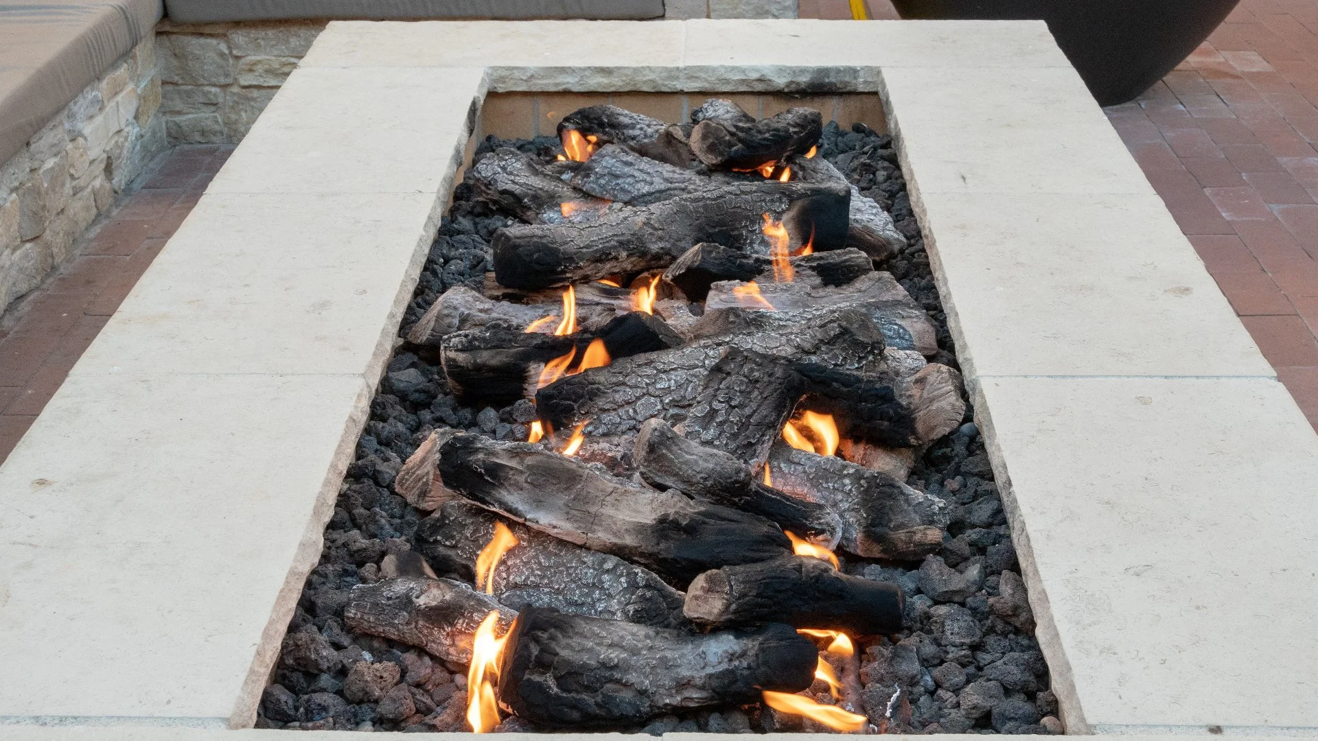 Is an Outdoor Fireplace or a Fire Pit Better for Your Outside Area?